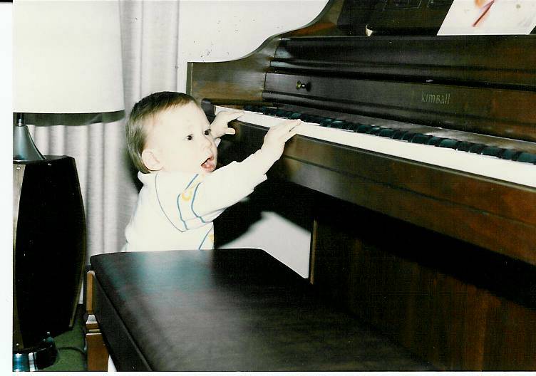 Me at the piano as a toddler